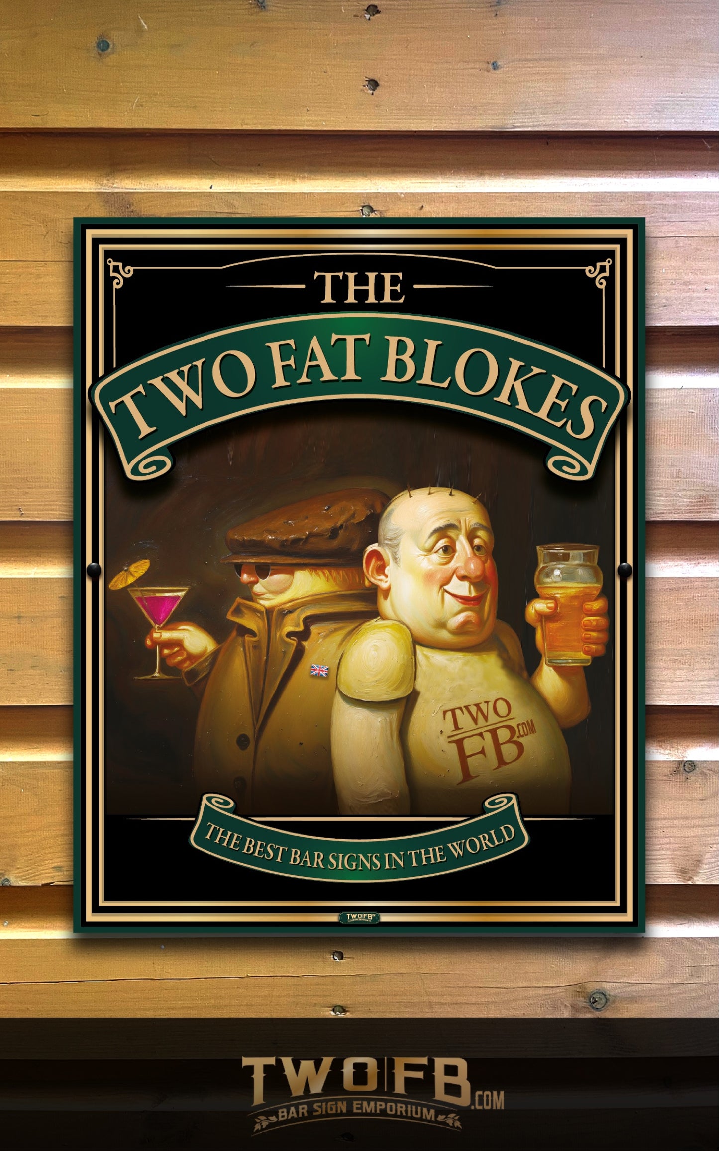 A framed novelty bar sign featuring an illustrated caricature of two stout-faced men, one holding a martini glass and the other a pint of beer, with the text 'THE TWO FAT BLOKES' and 'THE BEST BAR SIGNS IN THE WORLD.' The sign is shown against a wood plank wall, and a smaller 'TWOFB.