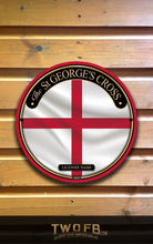 Load image into Gallery viewer, St. George's Cross emblem on a wooden background with 'TWO.FB' branding.