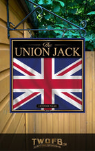 Load image into Gallery viewer, Union Jack sign with a British flag design on a wooden background