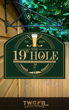Load image into Gallery viewer, Green sign with &#39;The 19th Hole&#39; logo and branding on a wooden wall.
