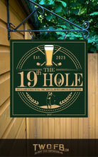 Load image into Gallery viewer, Decorative sign for &#39;The 19th Hole&#39; with golf-themed design on a green background.
