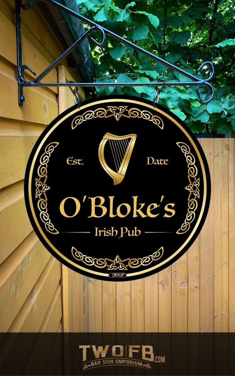 O'Bloke's Irish Pub sign on a wooden wall with greenery above.
