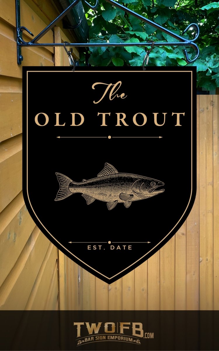 Sign for 'The Old Trout' with a fish illustration on a black background, hanging against a wooden wall.