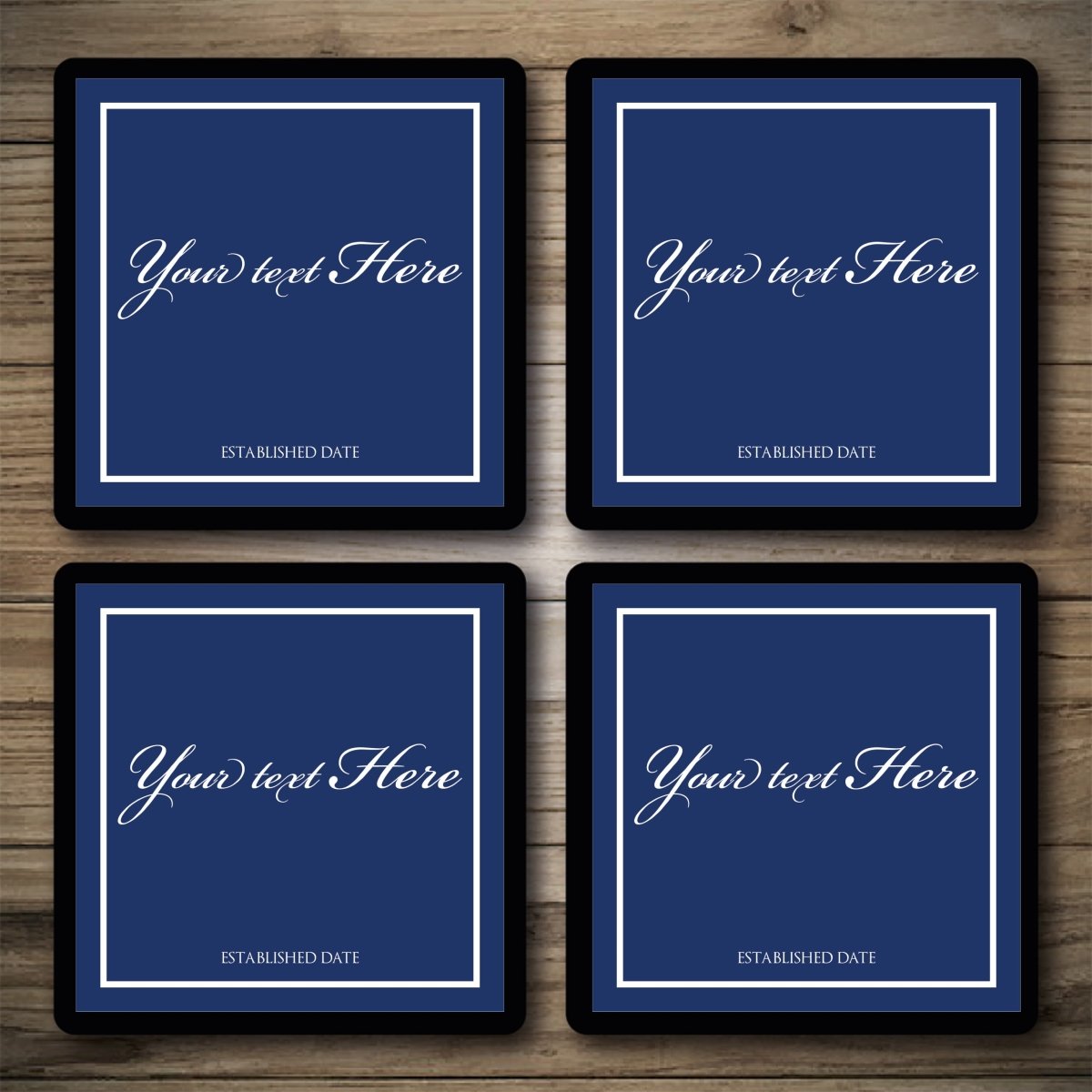 Four blue frames with customizable text on a wooden surface