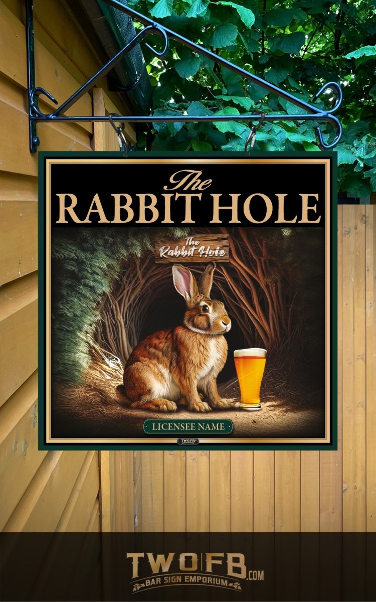 Decorative sign for 'The Rabbit Hole' with a rabbit holding a pint of beer, hanging on a wall.