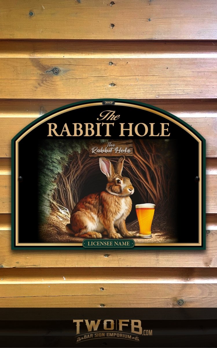 Decorative sign with a rabbit and beer glass on a wooden background, featuring 'The Rabbit Hole' and 'Two FB'.
