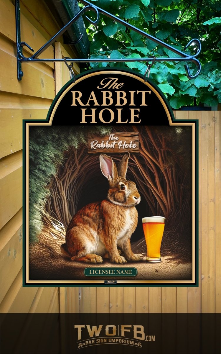 Decorative sign for 'The Rabbit Hole' with a rabbit holding a beer mug, hanging outside a building.