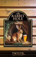 Load image into Gallery viewer, Decorative sign featuring a rabbit with a beer and &#39;The Rabbit Hole&#39; text on a wooden background.
