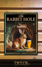Load image into Gallery viewer, Poster of a rabbit with a beer next to a sign that reads &#39;The Rabbit Hole&#39; on a wooden background.
