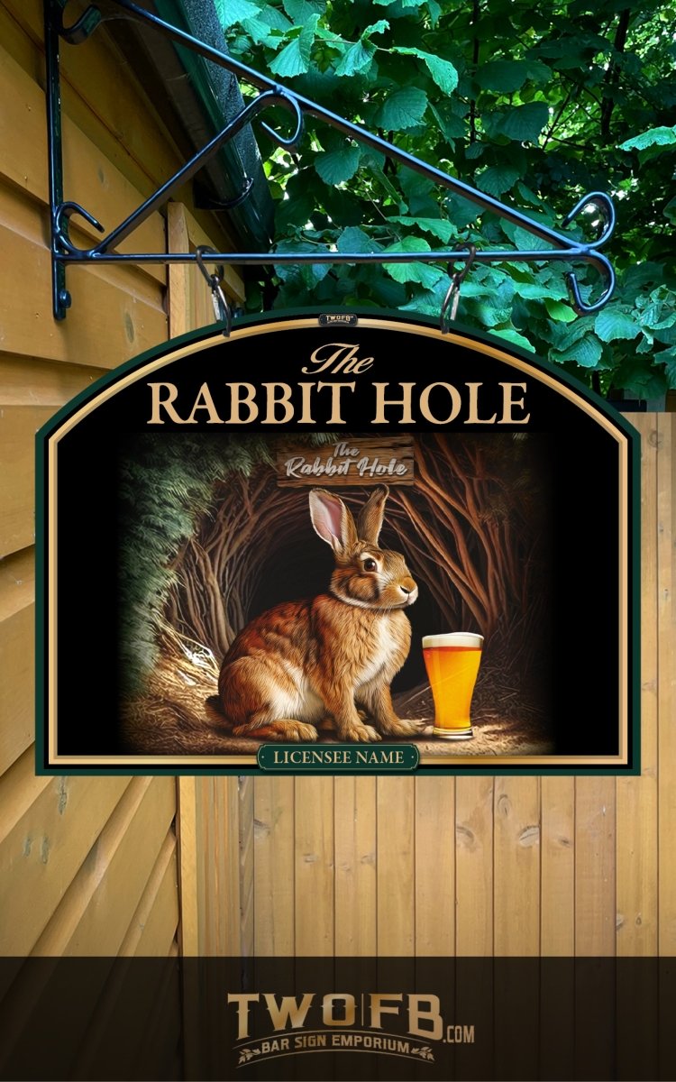 Decorative sign for 'The Rabbit Hole' with a rabbit and pint of beer, hanging against a wooden wall.