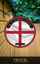 Load image into Gallery viewer, Round sign with St. George&#39;s Cross design on a wooden wall
